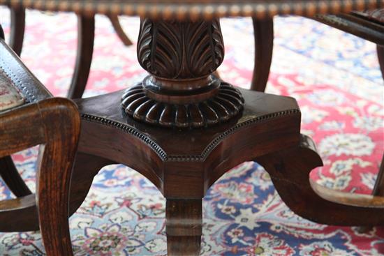 An early 19th century rosewood and brass inlaid breakfast table, Diam. 4ft